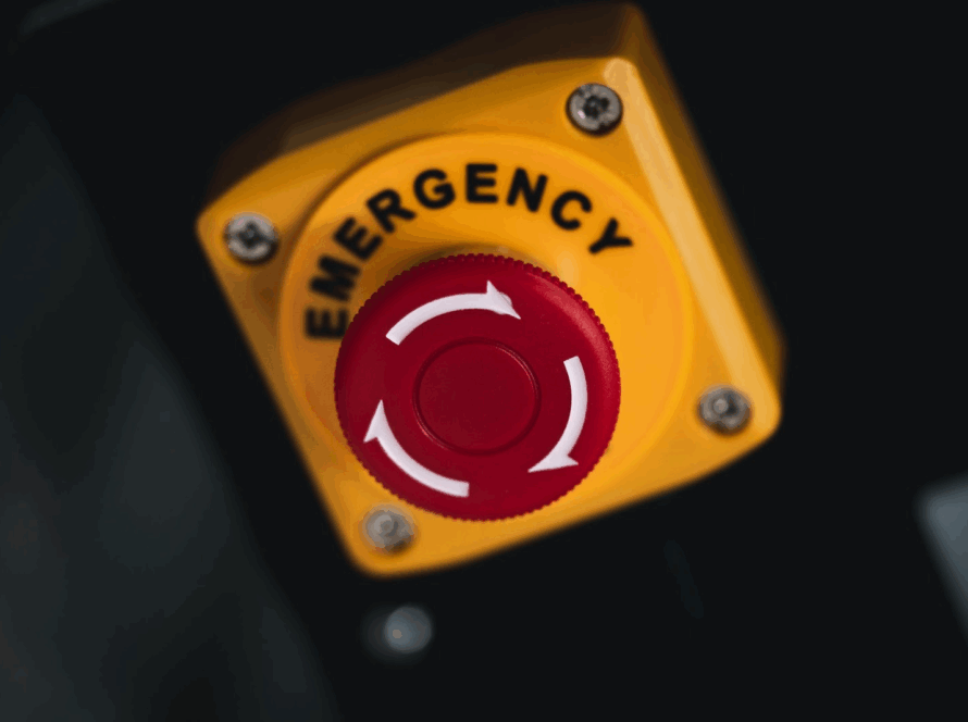 A close-up of an emergency stop button. 